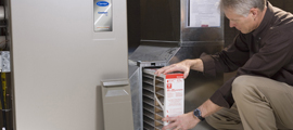 man inspecting furnace